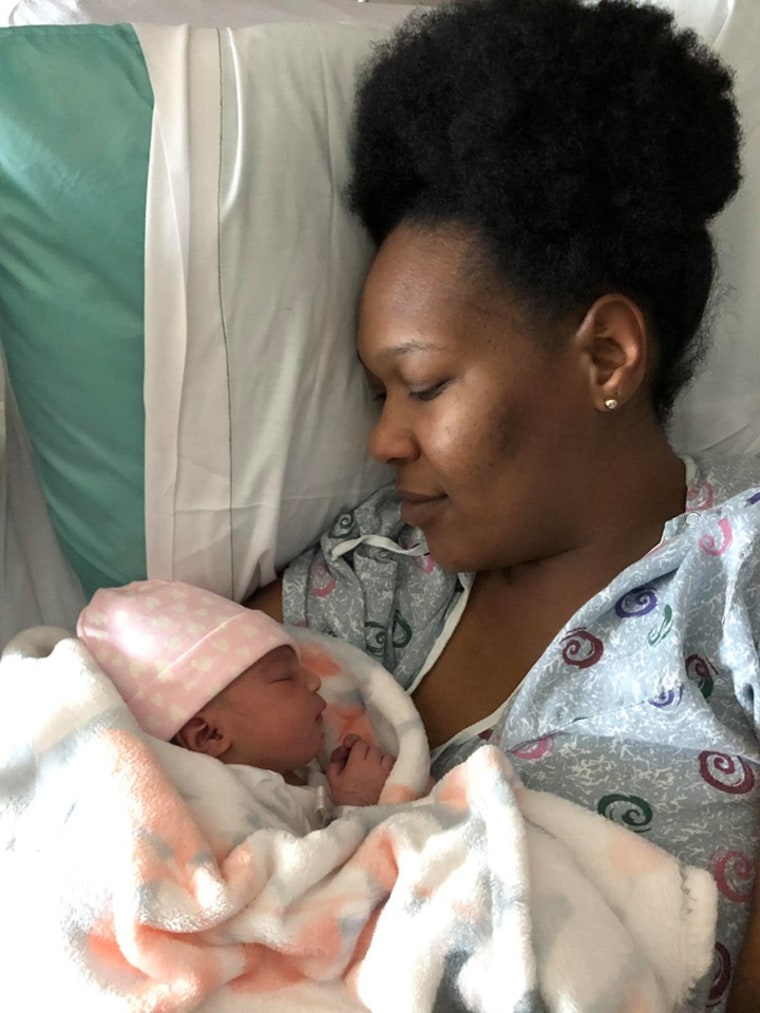 Mom Rudy Naper snuggles with baby Jolee, who was born in the front seat of a car.