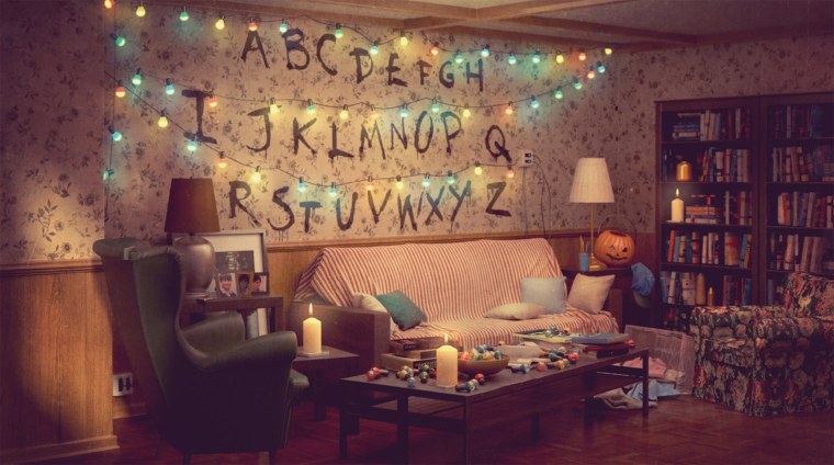 LED Lights and plenty of books decorate the "Stranger Things" living room.