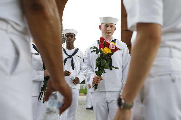 Image: Volunteers Place Flowers On Gravesites At Arlington National Cemetery Ahead Of Memorial Day