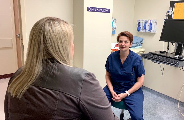 Obstetrician gynecologist Dr. Colleen McNicholas speaks with a patient at the Planned Parenthood of the St. Louis Region in St. Louis, Missouri.