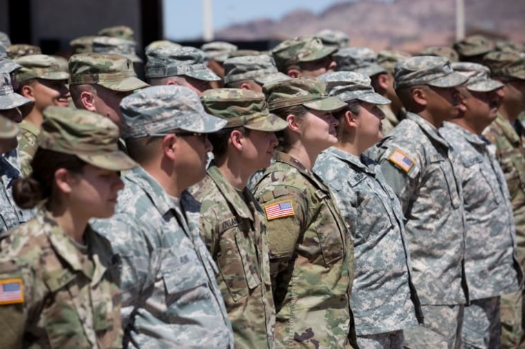 Members of the Arizona National Guard listen to instructions on April 9, 2018, at the Papago Park Military Reservation in Phoenix. - Arizona deployed its first 225 National Guard members to the Mexican border on Monday after President Donald Trump ordered thousands of troops to the frontier region to combat drug trafficking and illegal immigration.