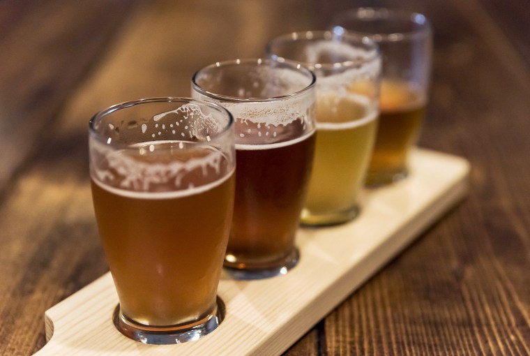 Image: Assorted craft beer samples at a micro-brewery