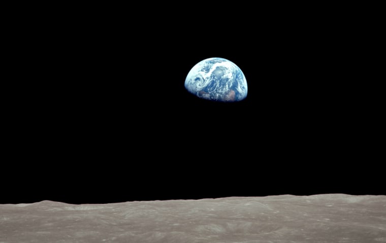 On December 24, 1968 during the Apollo 8 mission, the Earth rose into view over the Moon's limb.