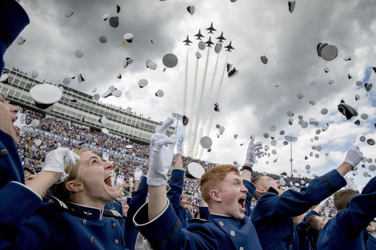 Image: The Thunderbirds fly overhead as United States Air Force Academy cadets toss their hats in the air during their graduation ceremony at Falcon Stadium on May 30, 2019, in Colorado Springs.