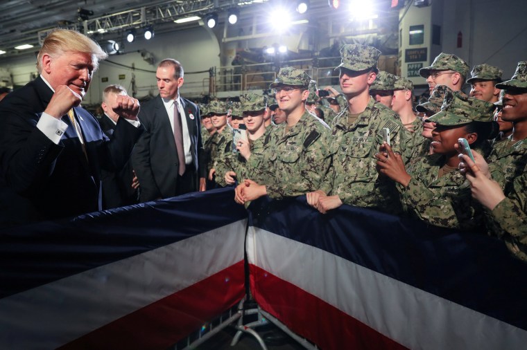 Image: U.S. troops take photos of U.S. President Trump aboard the USS Wasp in Yokosuka