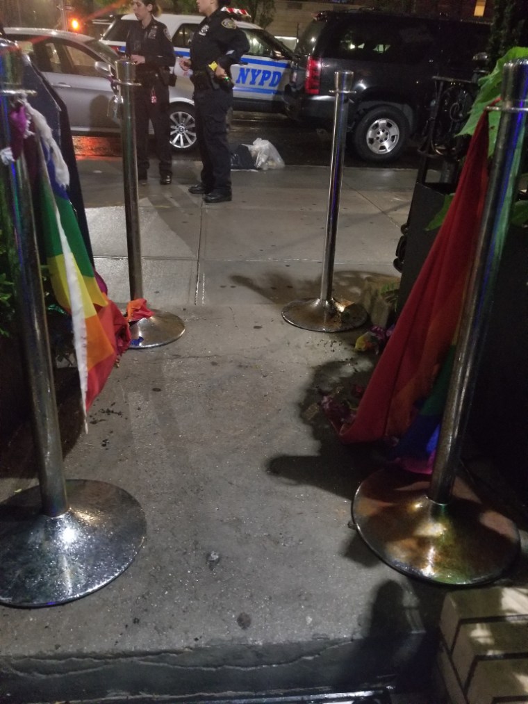 Pride flags were burned Friday outside Alibi Lounge in New York City.