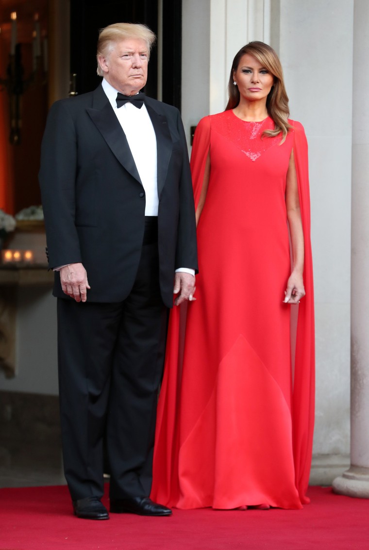 Melania Trump wears a red cape dress for dinner with Prince Charles