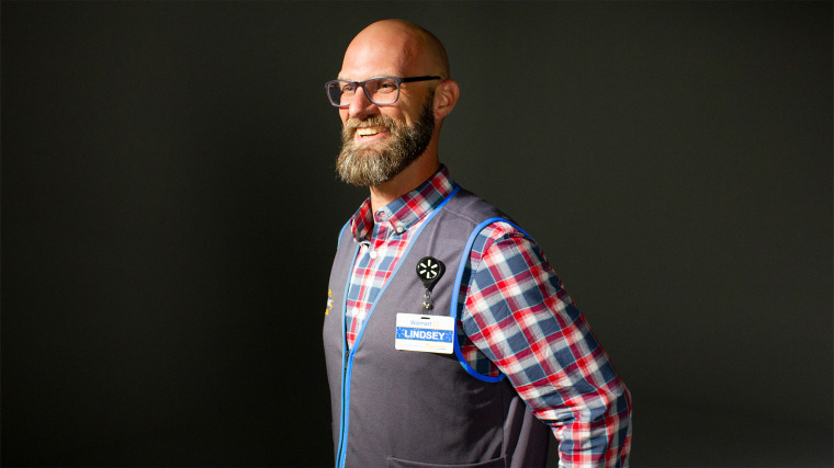 The employees at Walmart's traditional Supercenters will be wearing the new vests with the blue trim. 