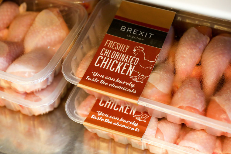 Image: Packs of \"Brexit Selection Freshly Chlorinated Chicken\" sit on display at the 'Costupper' Brexit Minimart pop-up store, set up by the People's Vote campaign group, in London