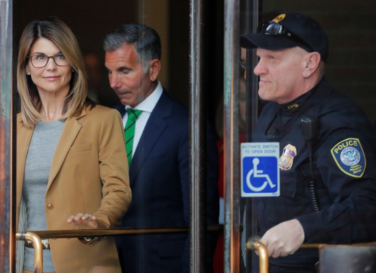 Actor Lori Loughlin, and husband, fashion designer Mossimo Giannulli, facing charges in a nationwide college admissions cheating scheme, leave federal court in Boston