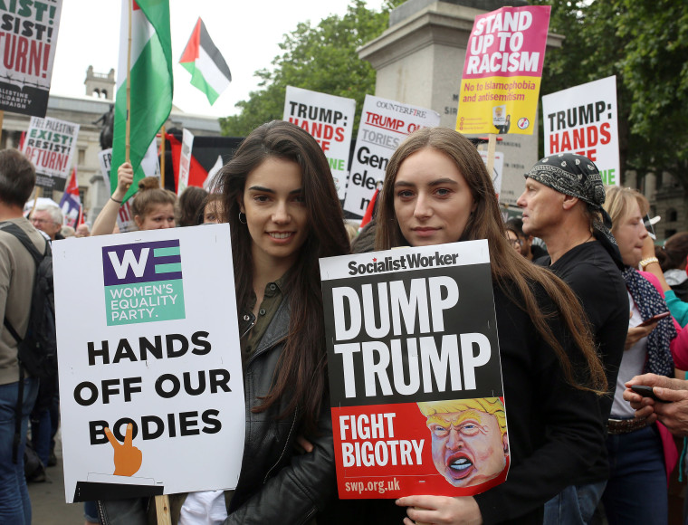Image: Sophie Pascale, (left) and Nika Gorod (right)  take part in the demonstration against President Donald Trump in London