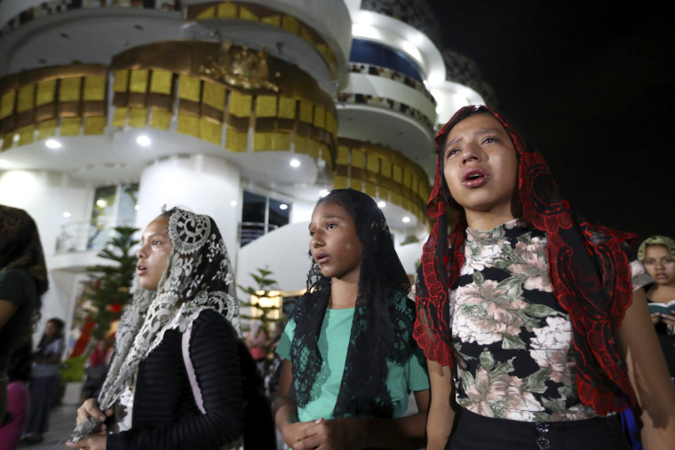 Image: Women pray outside the La Luz Del Mundo Church after learning their leader, Joaquin Garcia, was arrested in the United States on June 4, 2019.