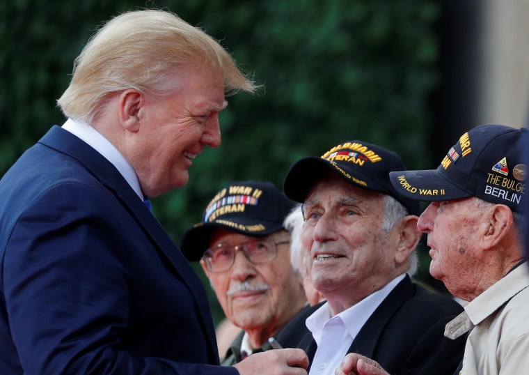 Image: President Donald Trump greets WWII D-Day veterans at the commemoration ceremony for the 75th anniversary of D-Day at the American cemetery of Colleville-sur-Mer in Normandy