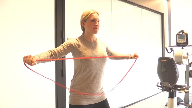 Monique Lamoureux-Morando used resistance bands as part of her post-partum workout.