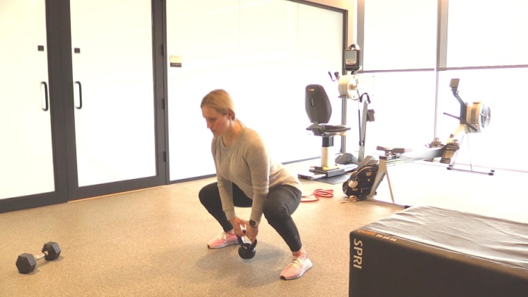 Monique Lamoureux-Morando demonstrating a sumo squat.