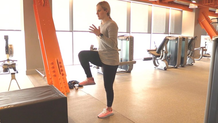 Monique Lamoureux-Morando doing hip flexion exercises, which were part of her post-partum workut plan.