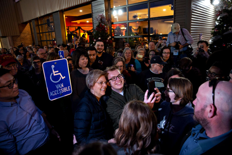 Image: Sen. Elizabeth Warren, D-Mass., takes a selfie with a supporter in Iowa on Jan. 4, 2019.