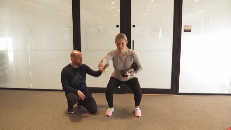 Monique Lamoureux-Morando practicing an off set squat.