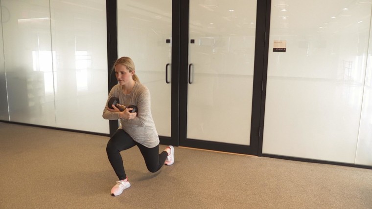 Monique Lamoureux-Morando doing a reverse lunge, an exercise where you can incorporate your baby as body weight.