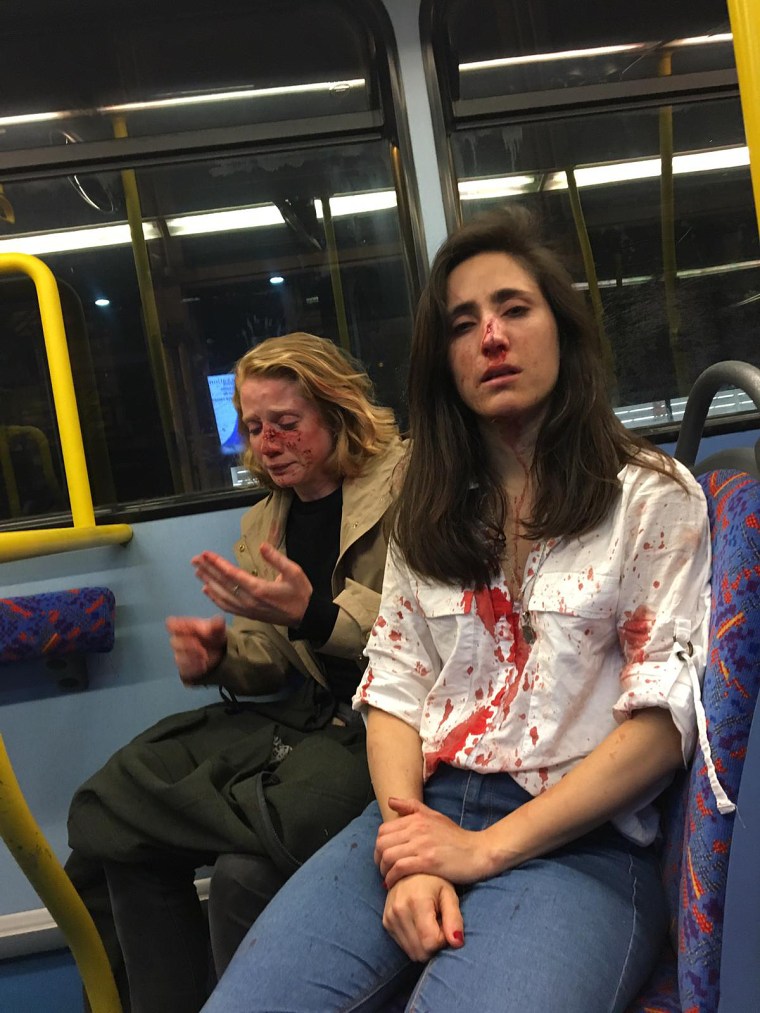 Chris, left, and Melania, on a bus in London.