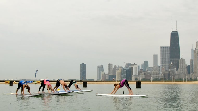 A yoga class being led by Chicago SUP on Lake Michigan.