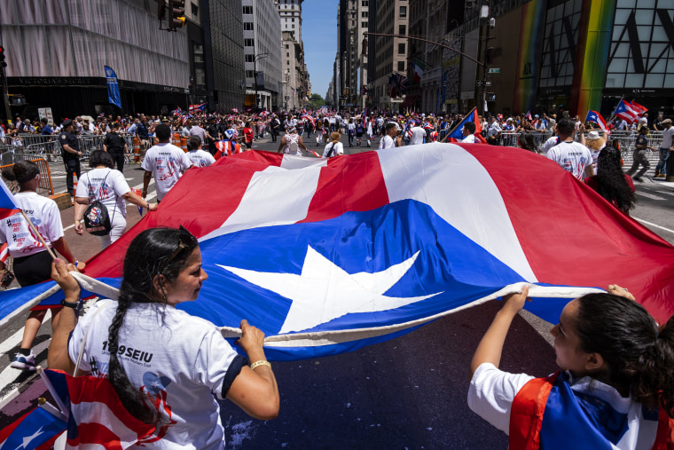 Image: People march in the Puerto Rican Day Parade on 5th Avenue in New York on June 9, 2019.