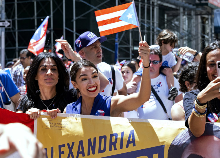 Image: Rep. Alexandria Ocasio-Cortez, D-NY, marches in the Puerto Rican Day Parade on June 9, 2019.