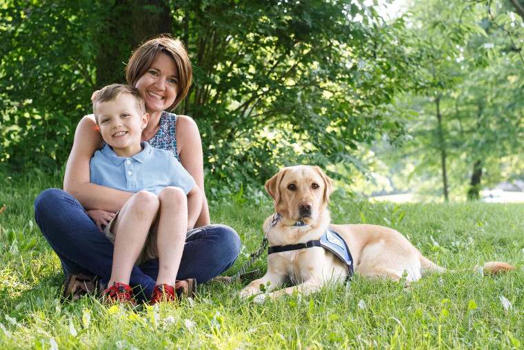 Amanda Swearingen and her son, Gavin, and his service dog, Elmer