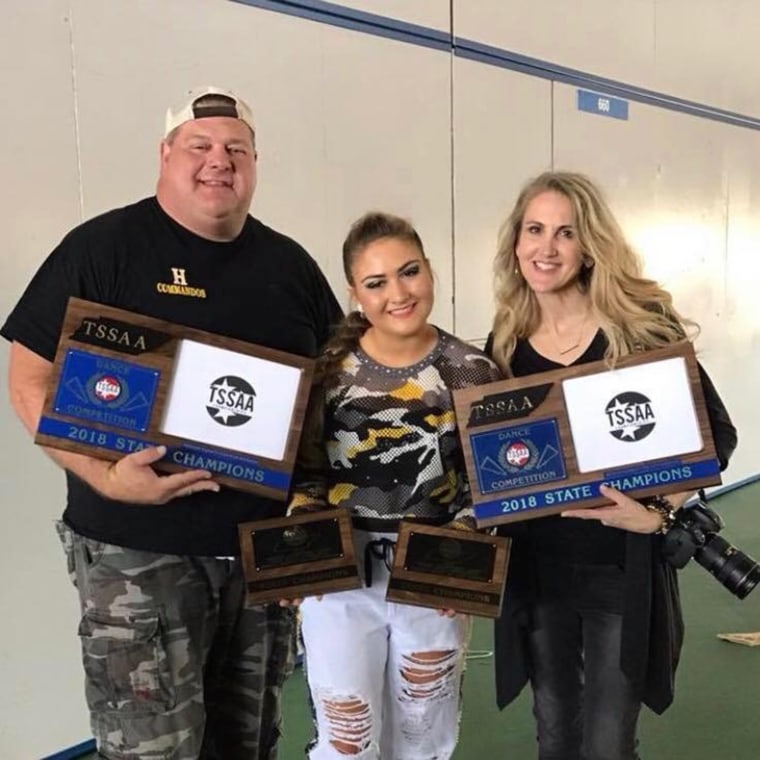 Dad Jason Patterson and mom Danielle Patterson have supported their daughter, Isabella Patterson, center, in dance since she was 3 years old. Here, they celebrate a state championship win for the Hendersonville High School Golden Girls dance team in Hende