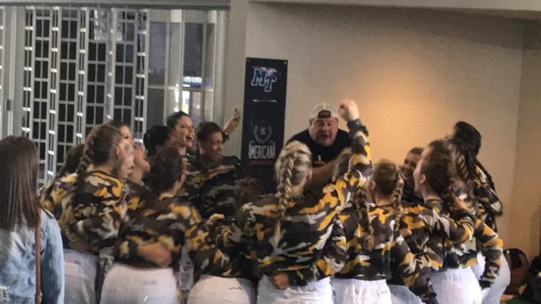 Dad Jason Patterson has his own special way of getting the members of the Hendersonville High School Golden Girls dance team all fired up and ready to compete.