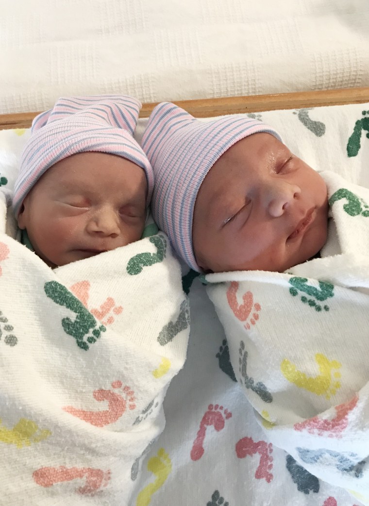 Twins Rhett and Rhenley snuggling in the hospital. 