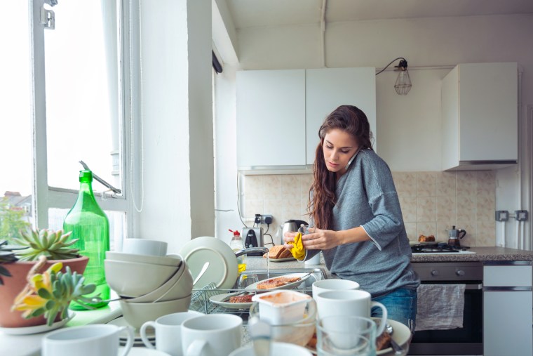 Woman washing dishes