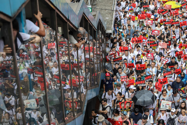 Image: Protesters flood the streets of Hong Kong on Sunday