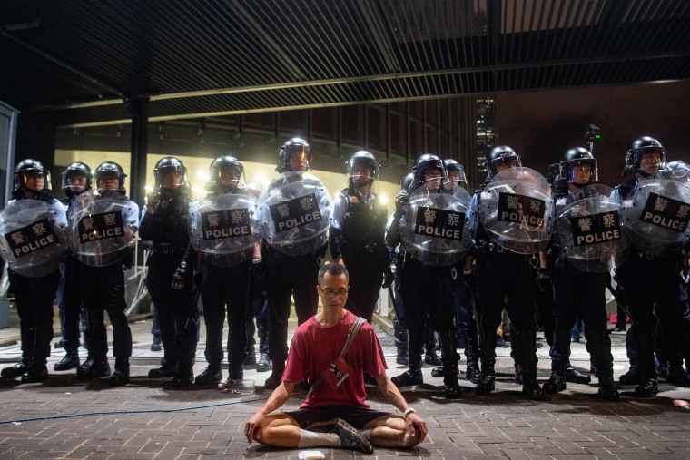 Police gather at the rally early Monday.