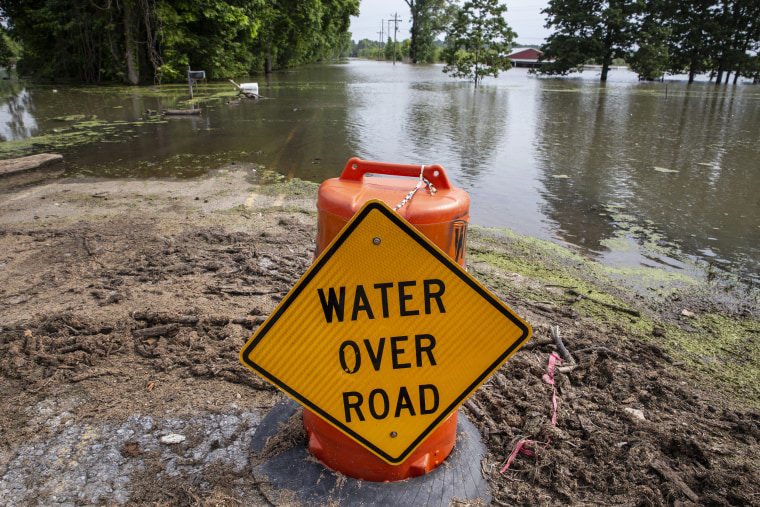 A sign warning motorist of flood water is placed on Flowree Road near Redwood, Mississippi on June 4, 2019.