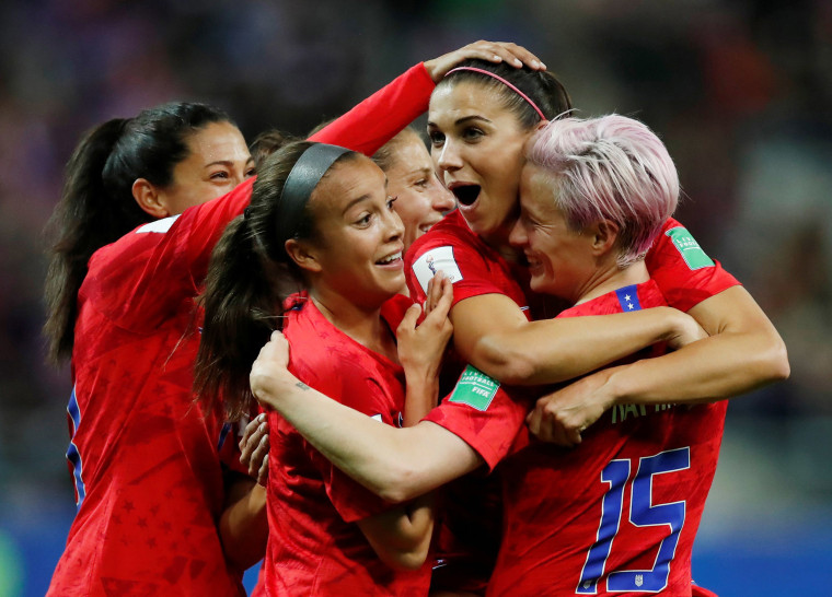 Image: Alex Morgan of the U.S. celebrates scoring their twelfth goal with Megan Rapinoe and team mates in the Women's World Cup Group F fixture against Thailand