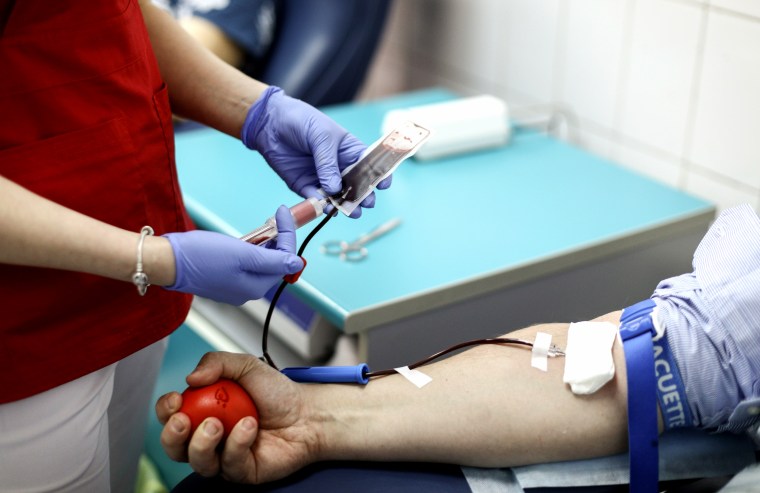 Image: A person donating blood in 2018.