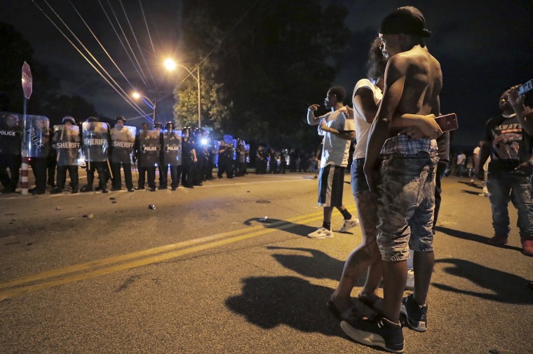 Image: A man identified as Sonny Webber, right, the father of Brandon Webber, joins a standoff as protesters march in the streets on Memphis on June 12, 2019.