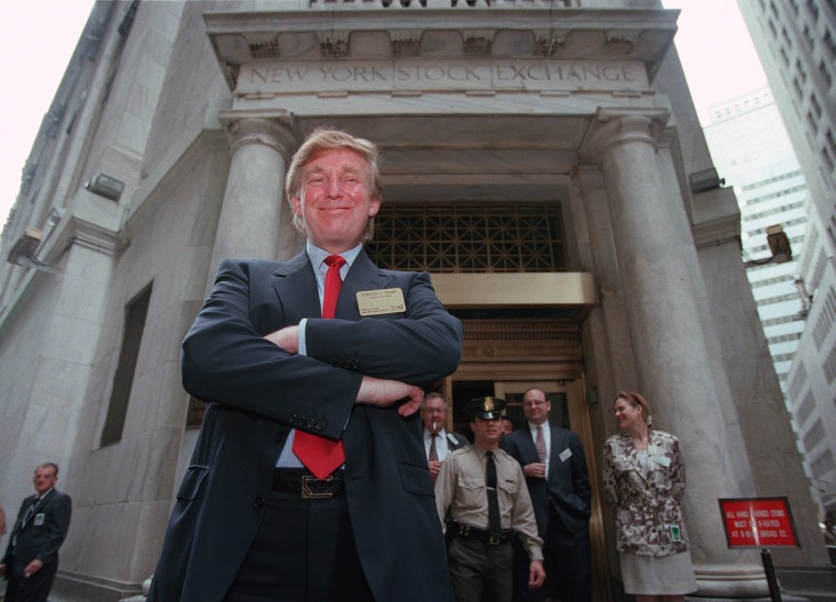 Image: Trump poses for photos outside the New York Stock Exchange after the listing of his stock