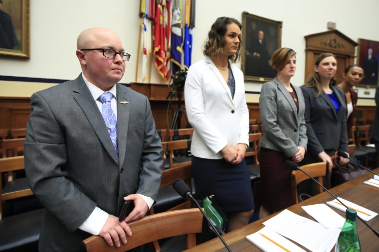 Image: Transgender military members Navy Lt. Cmdr. Blake Dremann, Army Capt. Alivia Stehlik, Army Capt. Jennifer Peace, Army Staff Sgt. Patricia King and Navy Petty Officer Third Class Akira Wyatt, before the start of a House Armed Services Subcommittee h