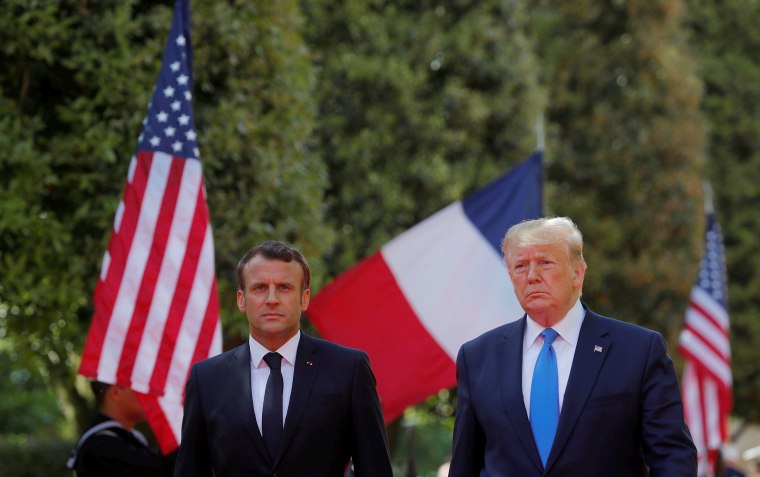 Image: President Donald Trump and French President Emmanuel Macron attend a French-American commemoration ceremony for the 75th anniversary of D-Day at the American cemetery of Colleville-sur-Mer in Normandy