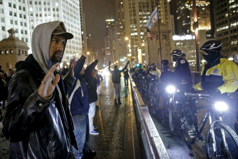 Protesters confront police while responding to the fatal shooting of Laquan McDonald in Chicago on Nov. 25, 2015.