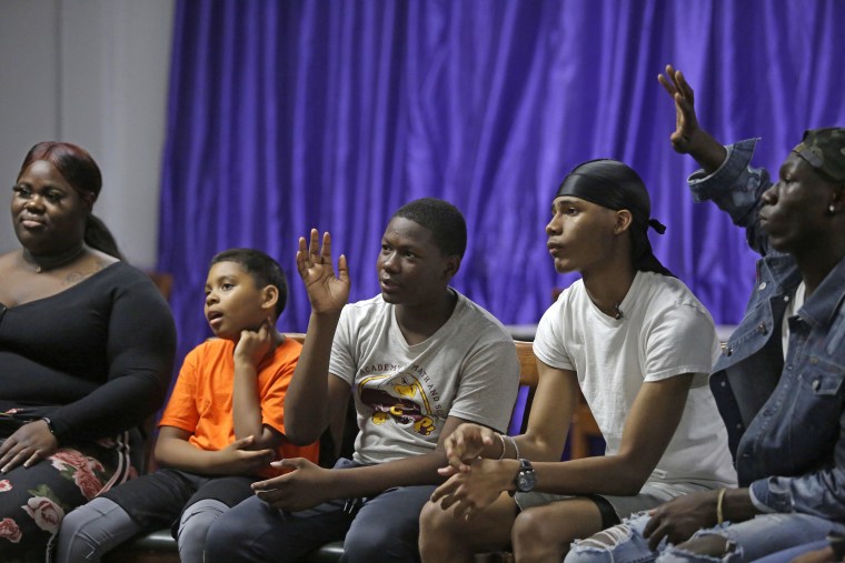 Darrion Johnson raises his hand to answer a question during the training session.