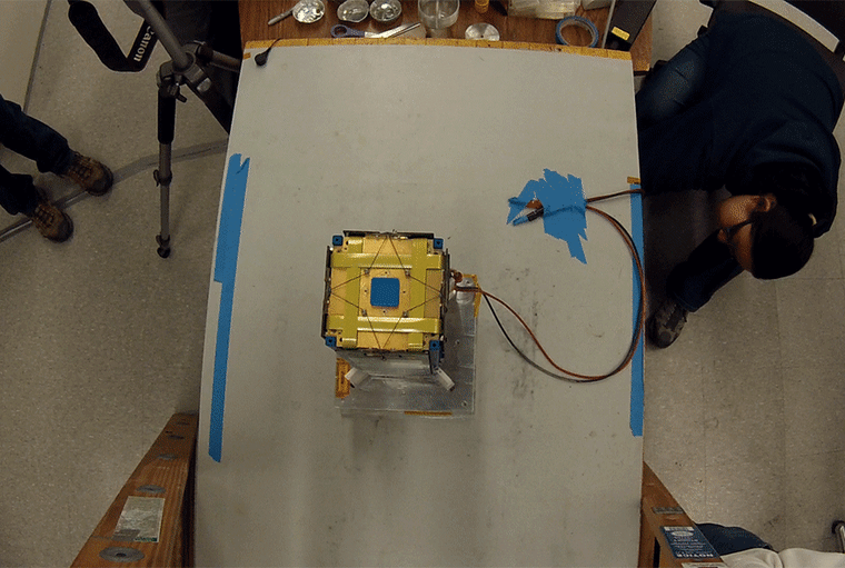 Image: E-TBEx's deployment is tested at the Michigan Exploration Lab. Constructing and testing the E-TBEx CubeSats was particularly complex because of the multiple antennas and solar panels that deploy after launch.