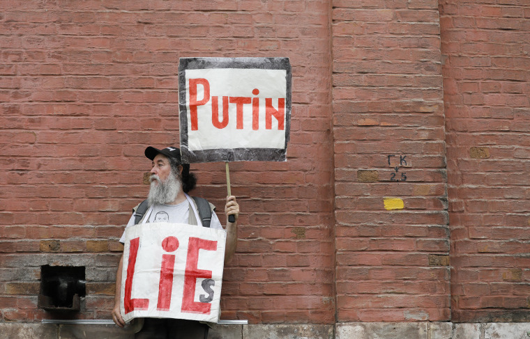 Image: A man attends a rally in support of Russian investigative journalist Ivan Golunov in Moscow