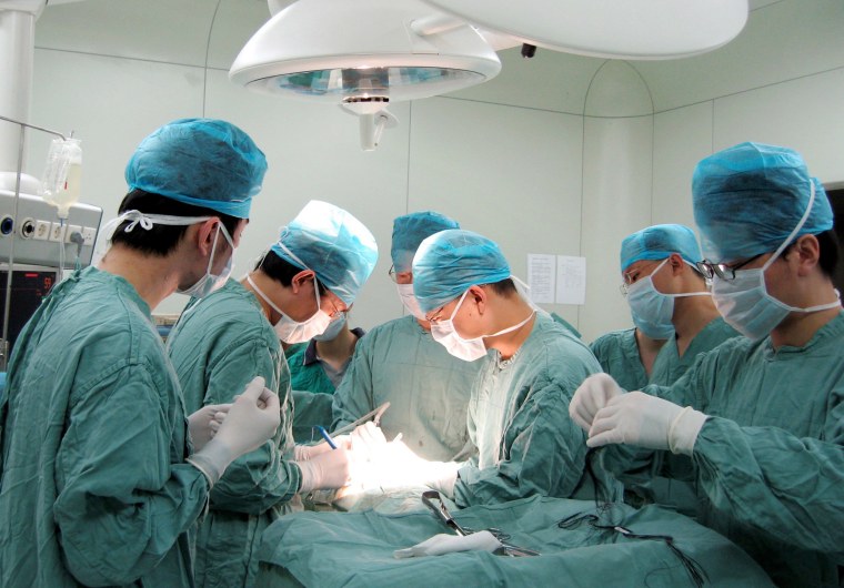 Image: Chinese doctors perform a kidney transplant operation at the Second Xiangya Hospital of the Central South University in Changsha city, Hunan province