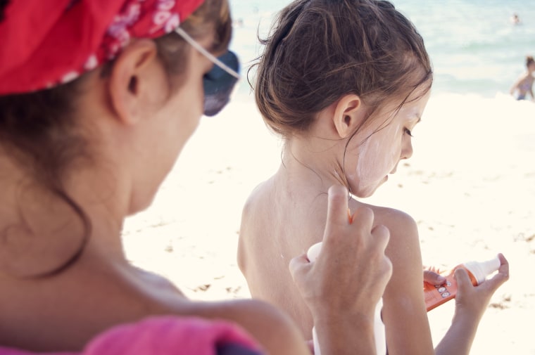 Image: Sun protection, Woman applying sunscreen to her daughter