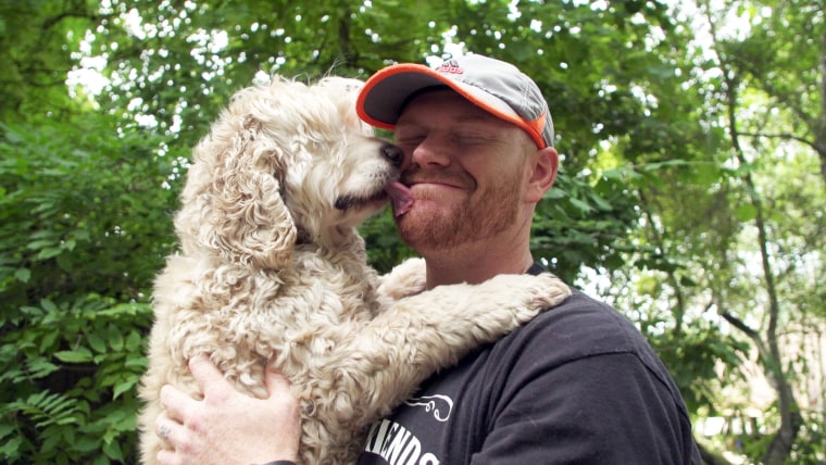 Mason Taylor with Mack the dog at Old Friends Senior Dog Sanctuary in Tennessee