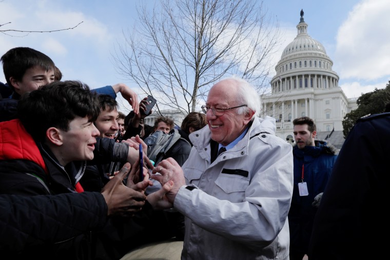 Senator Sanders greets students gathering outside the U.S. Capitol as part of a nationwide walk-out of classes to demand stricter gun laws