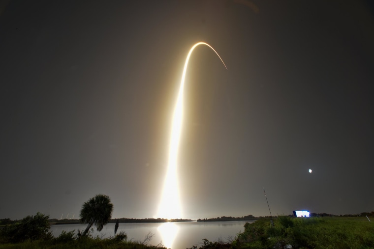 Image: A SpaceX Falcon Heavy rocket, carrying the U.S. Air Force's Space Test Program 2 Mission, lifts off from the Kennedy Space Center in this time exposure from Cape Canaveral, Florida